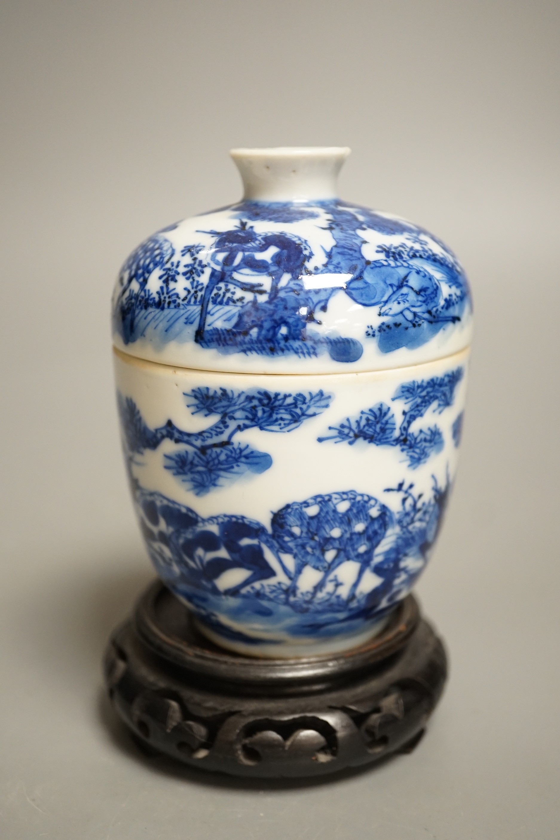 A 19th century Chinese blue and white ‘eight deer’ bowl and cover, ‘man tang fu ji’ mark, 12cm excluding wood stand